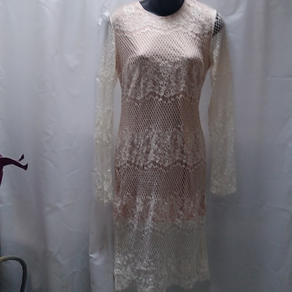 Glamorous skin color dress with white lace over it